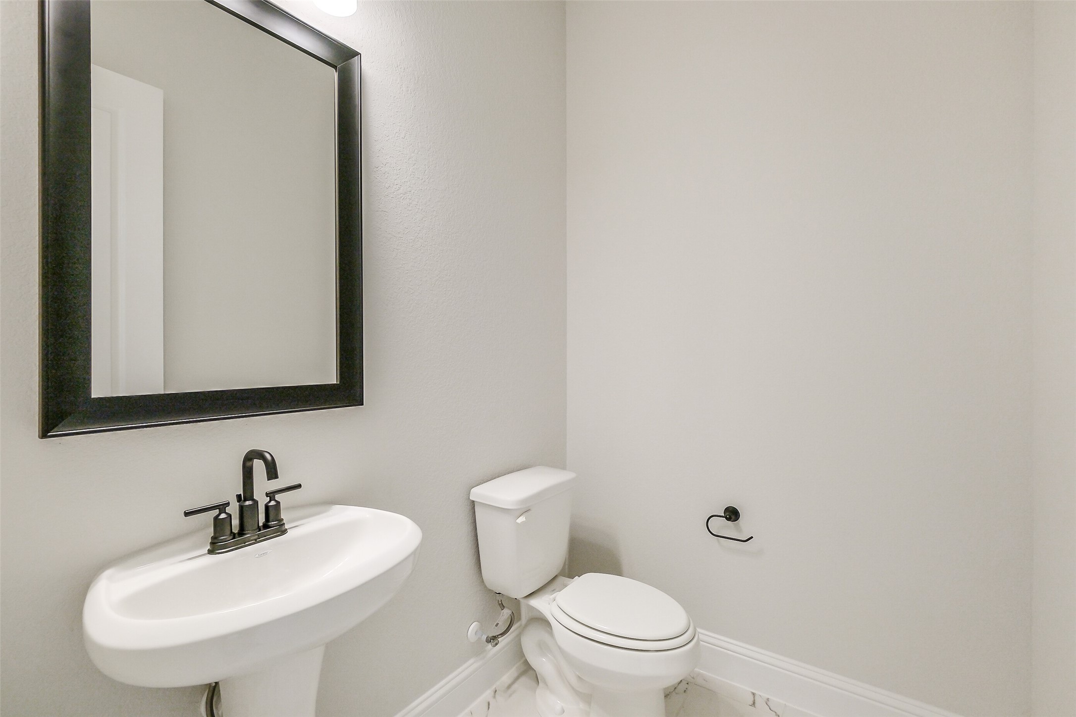 12965 Whitewater Way Conroe, TX 77302 - Photo 22 of 50 a bathroom with a sink a toilet and mirror