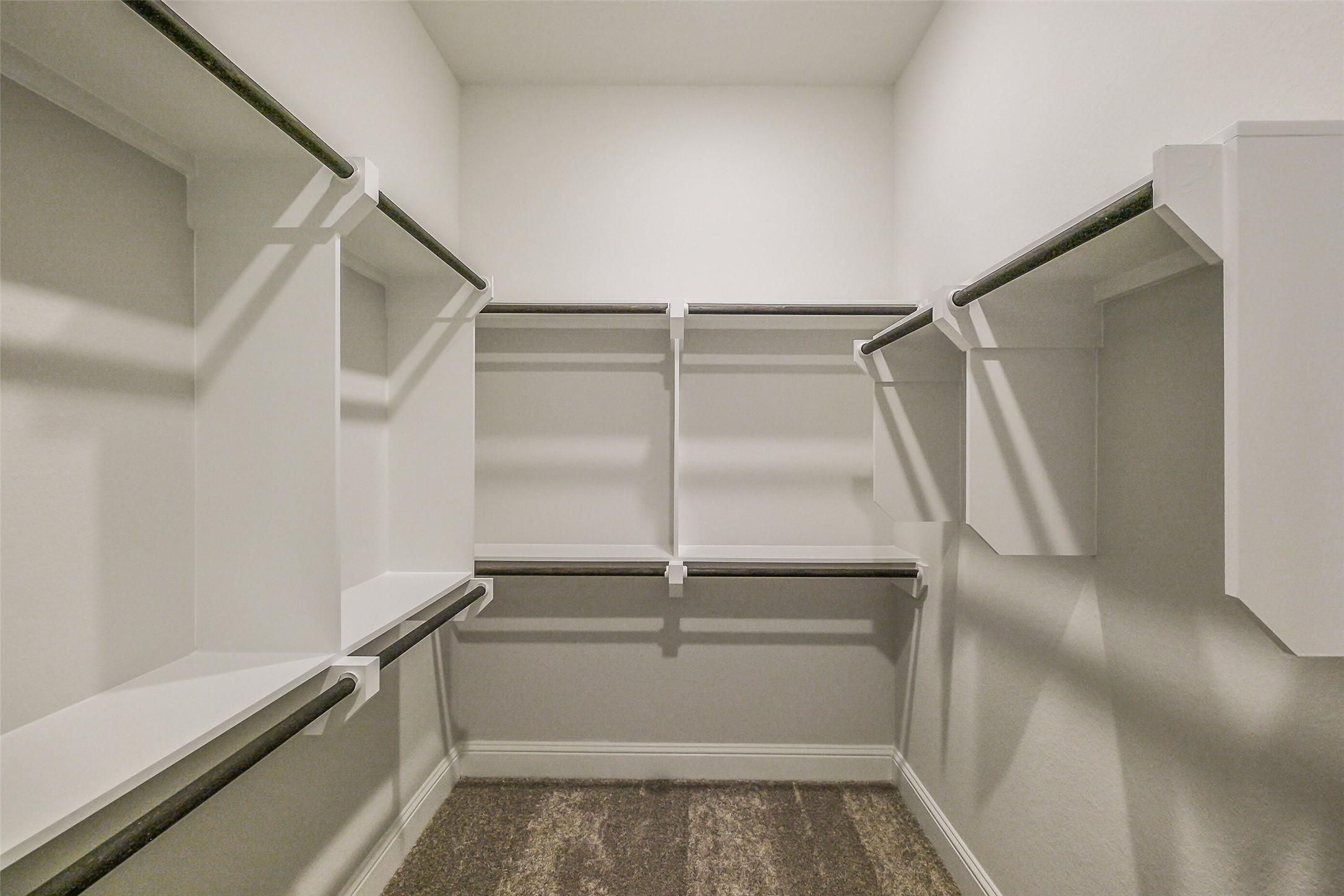 12965 Whitewater Way Conroe, TX 77302 - Photo 31 of 50 a view of walk in closet with empty racks