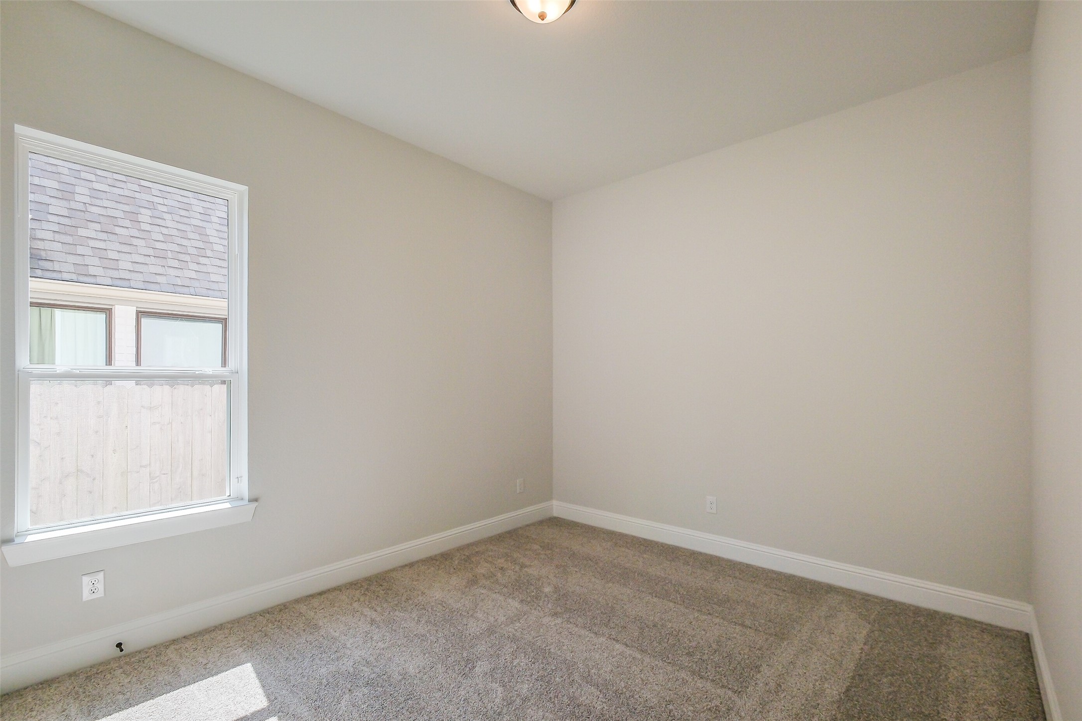 12965 Whitewater Way Conroe, TX 77302 - Photo 34 of 50 an empty room with a window