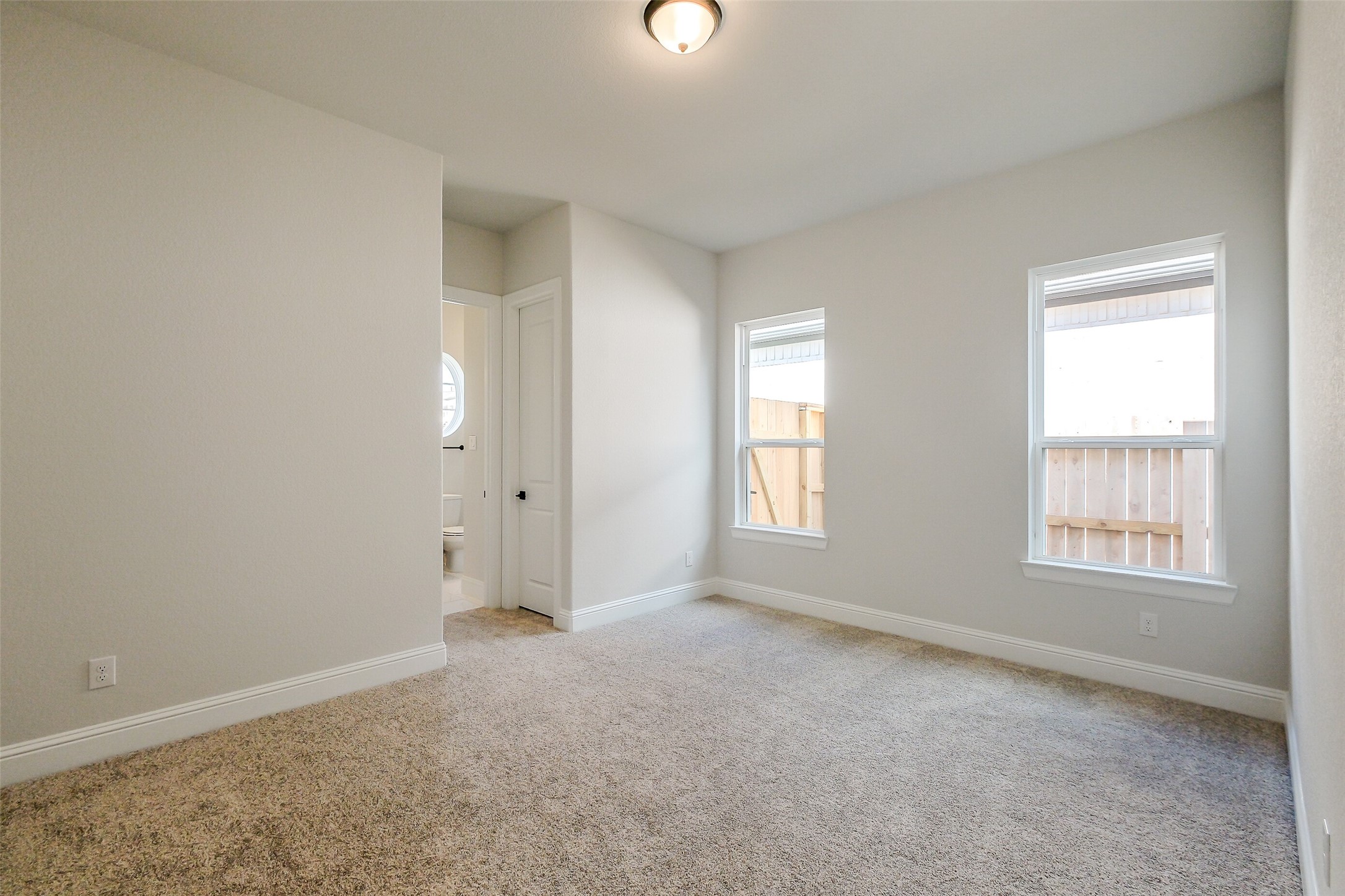 12965 Whitewater Way Conroe, TX 77302 - Photo 35 of 50 an empty room with windows and closet