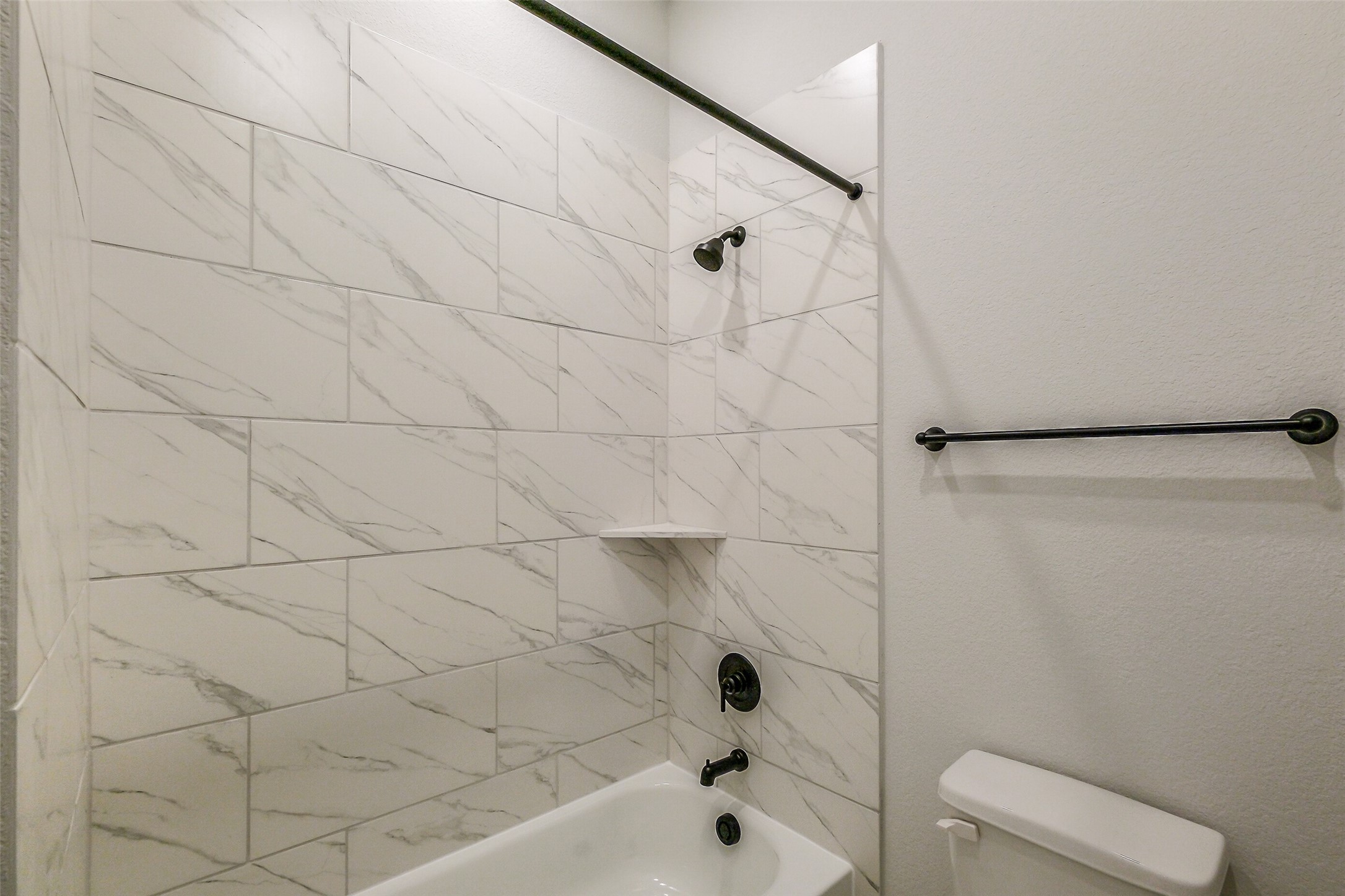 12965 Whitewater Way Conroe, TX 77302 - Photo 44 of 50 a bathroom with a bathtub and a shower