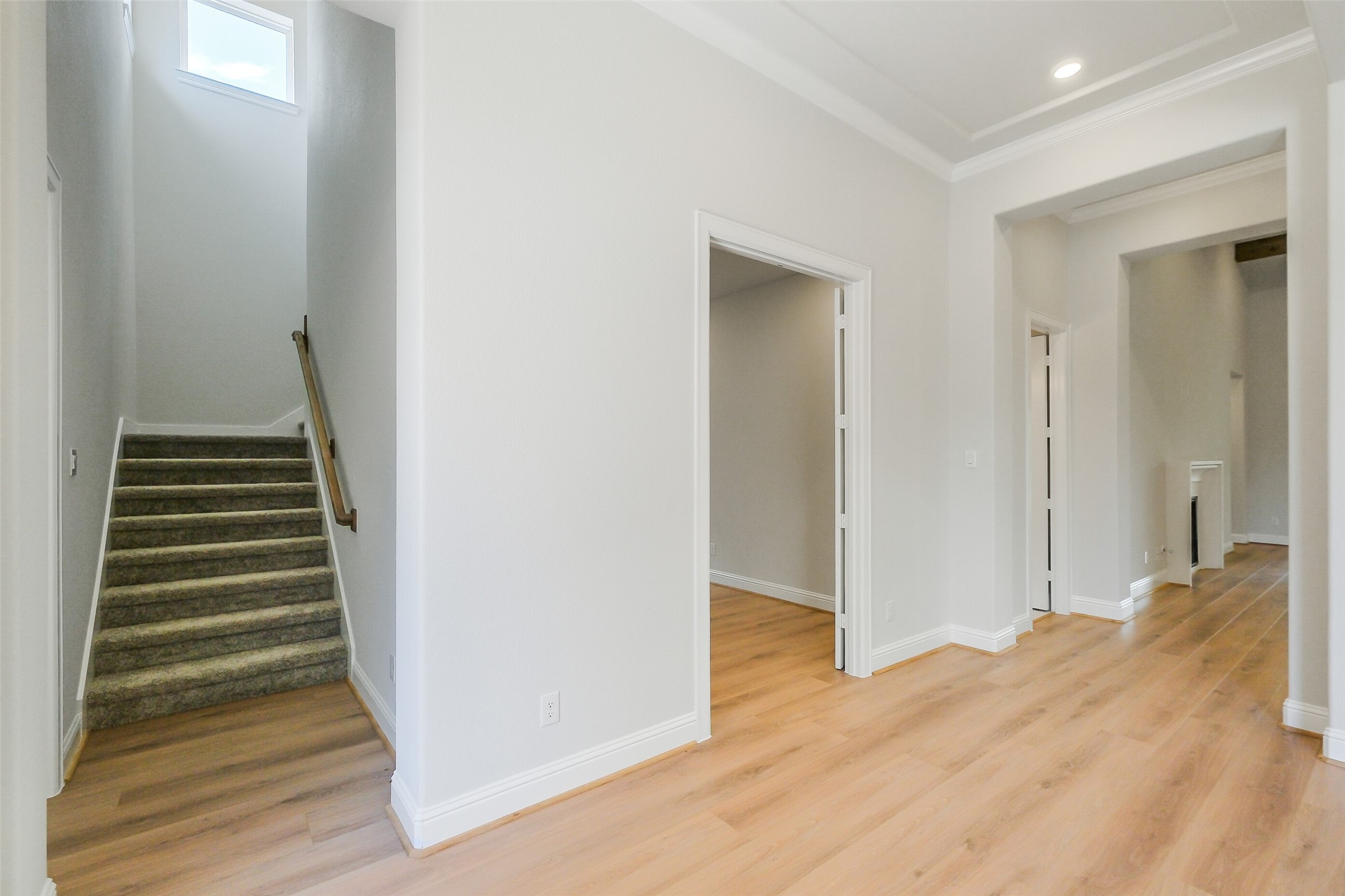 12965 Whitewater Way Conroe, TX 77302 - Photo 8 of 50 a view of a hallway with wooden floor and entryway