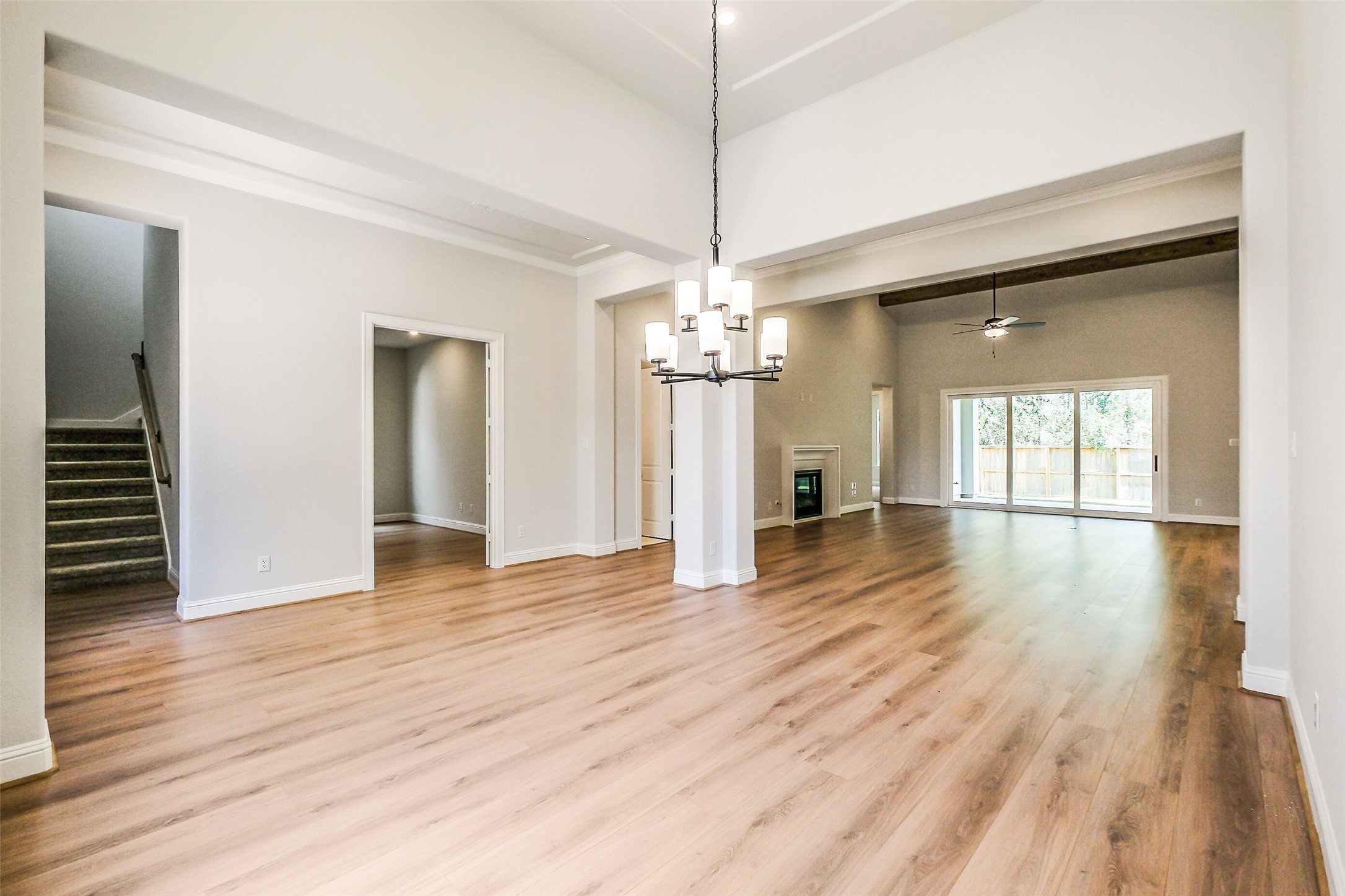 12965 Whitewater Way Conroe, TX 77302 - Photo 9 of 50 a view of a livingroom with wooden floor and staircase