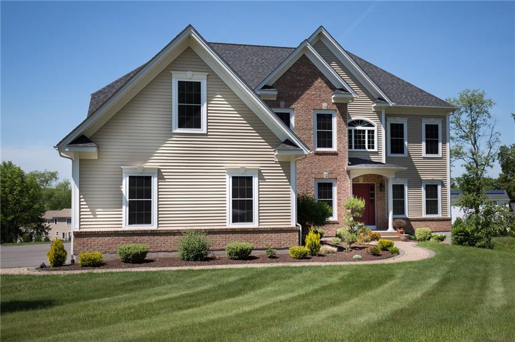 8 Frazer Fir Road South Windsor, CT 06074 - Photo 1 of 1 a front view of a house with a yard