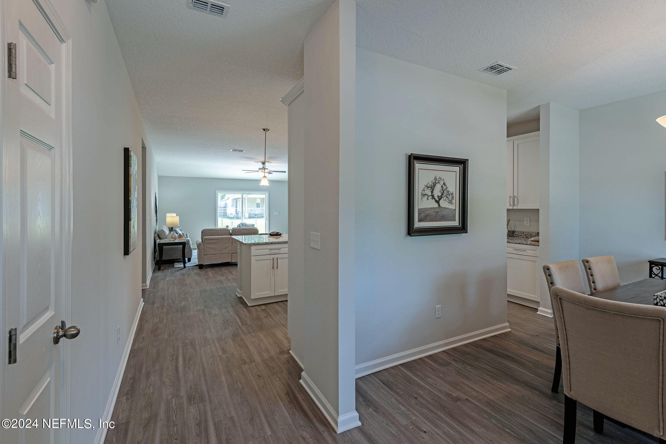 4031 Spring Glen Road Jacksonville, FL 32207 - Photo 3 of 40 a view of a living room and bathroom with wooden floor