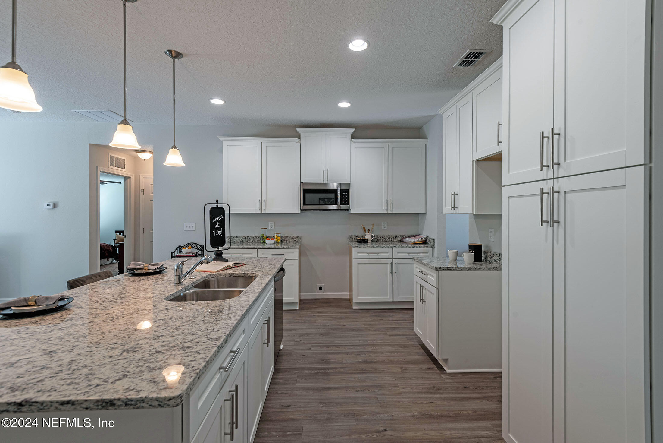 4031 Spring Glen Road Jacksonville, FL 32207 - Photo 9 of 40 a kitchen with stainless steel appliances granite countertop a sink a stove a refrigerator and cabinets