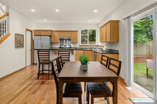 a view of a dining room with furniture window and wooden floor