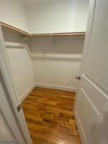 a bathroom with a granite countertop toilet and a bathtub