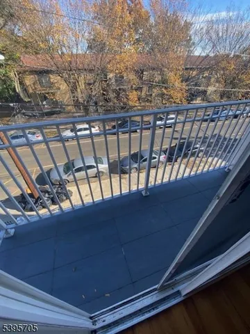 a view of balcony with furniture