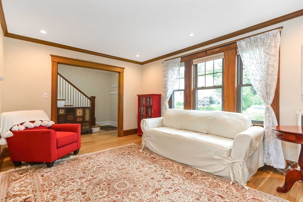 15 Evans Road Needham, MA 02492 - Photo 11 of 30 a living room with furniture and a large window