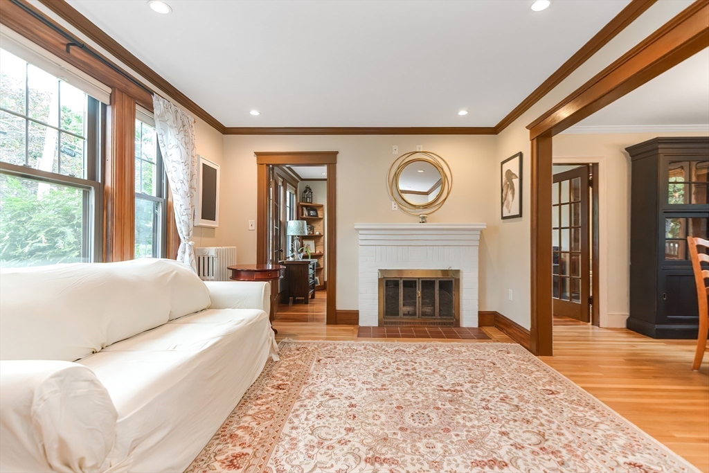 15 Evans Road Needham, MA 02492 - Photo 13 of 30 a living room with furniture and a fireplace