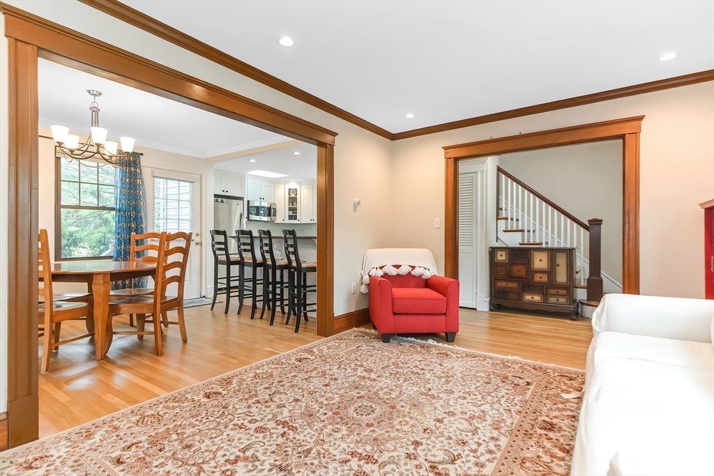 15 Evans Road Needham, MA 02492 - Photo 14 of 30 a living room with furniture a flat screen tv and a large window