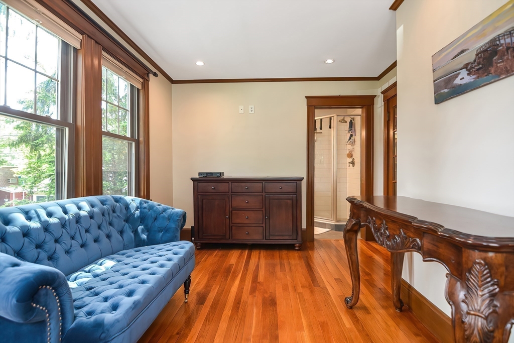 15 Evans Road Needham, MA 02492 - Photo 17 of 30 a living room with a couch and next to a window