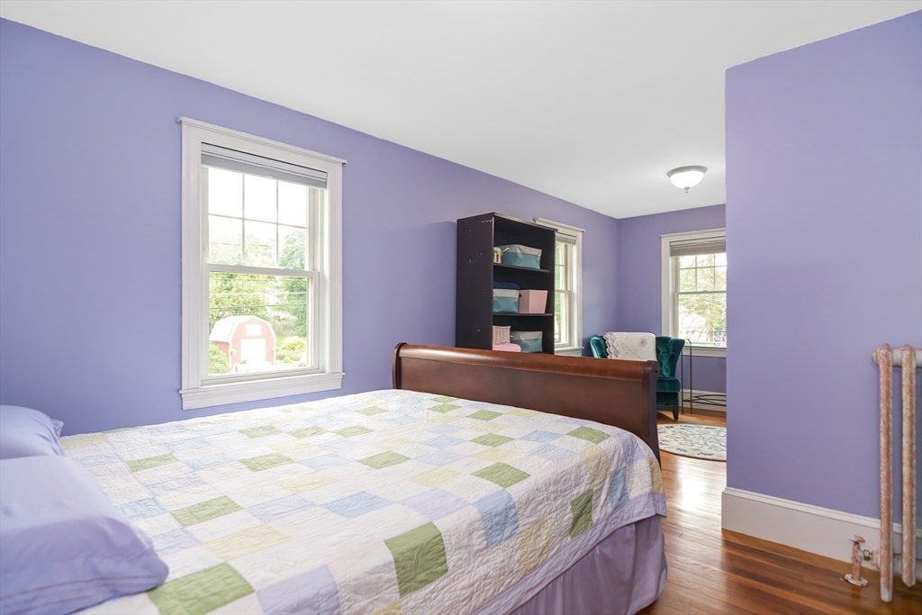 15 Evans Road Needham, MA 02492 - Photo 18 of 30 a bedroom with a bed and a large window