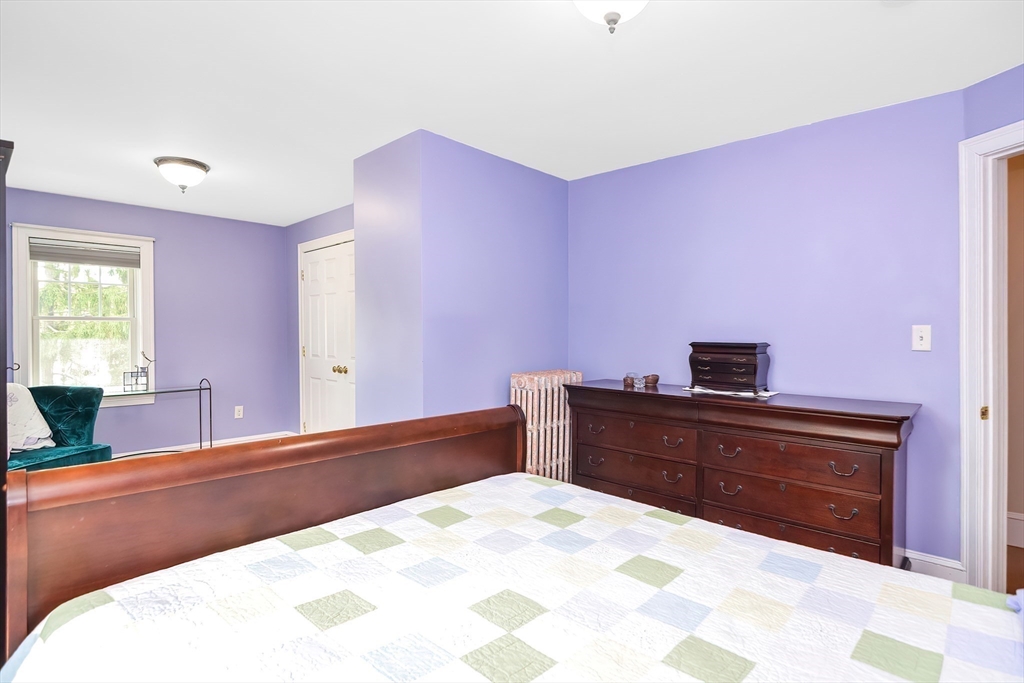 15 Evans Road Needham, MA 02492 - Photo 19 of 30 a bedroom with a bed and a dresser