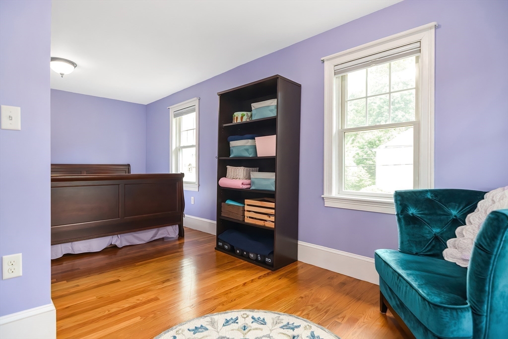15 Evans Road Needham, MA 02492 - Photo 20 of 30 a living room with furniture and a flat screen tv