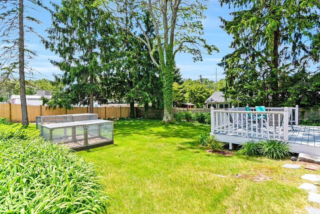 15 Evans Road Needham, MA 02492 - Photo 2 of 30 a small garden with wooden fence