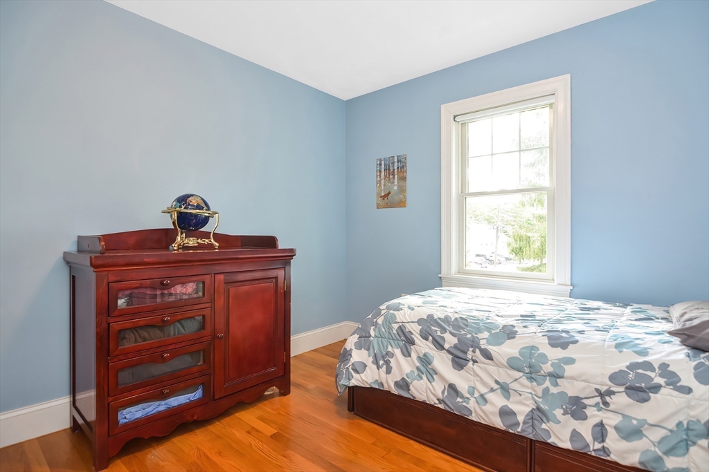 15 Evans Road Needham, MA 02492 - Photo 22 of 30 a bedroom with a bed and a window