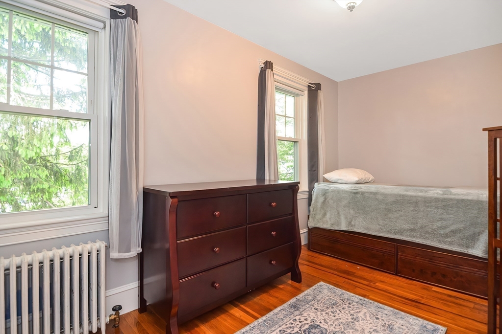 15 Evans Road Needham, MA 02492 - Photo 24 of 30 a room with a bed mirror and window