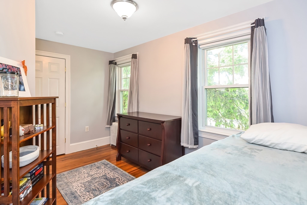 15 Evans Road Needham, MA 02492 - Photo 25 of 30 a bedroom with a bed and a dresser