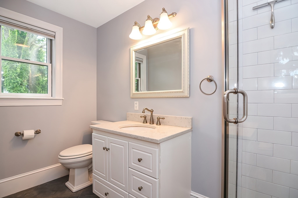 15 Evans Road Needham, MA 02492 - Photo 29 of 30 a bathroom with a toilet sink and mirror
