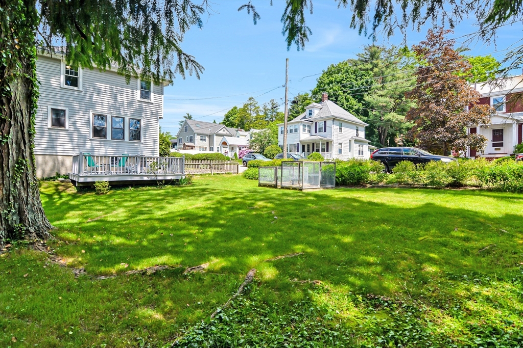 15 Evans Road Needham, MA 02492 - Photo 4 of 30 a view of a house with a yard and sitting area