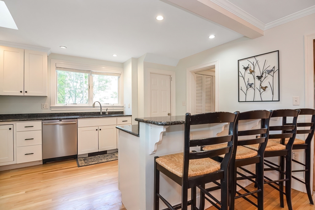 15 Evans Road Needham, MA 02492 - Photo 7 of 30 a view of a kitchen with granite countertop wooden floor and white furniture