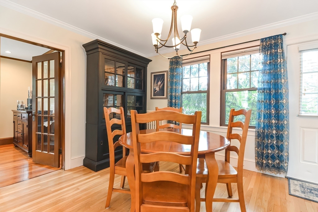 15 Evans Road Needham, MA 02492 - Photo 10 of 30 a view of a dining room with furniture large window and wooden floor