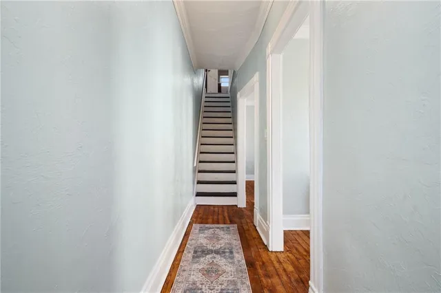 a view of a hallway with stairs
