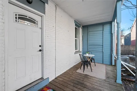 a view of a livingroom with furniture and wooden floor