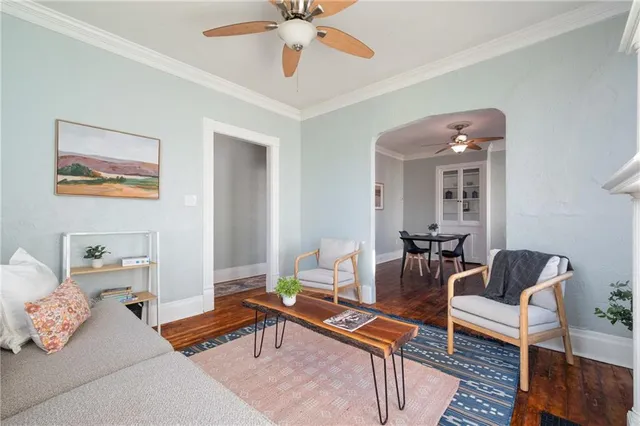 a bedroom with furniture and a ceiling fan