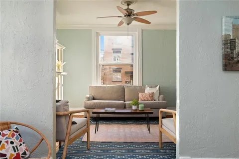 a living room with furniture and a window