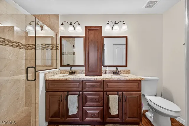 an empty room with a window and a ceiling fan