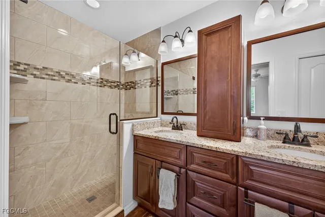 an empty room with a ceiling fan and a window