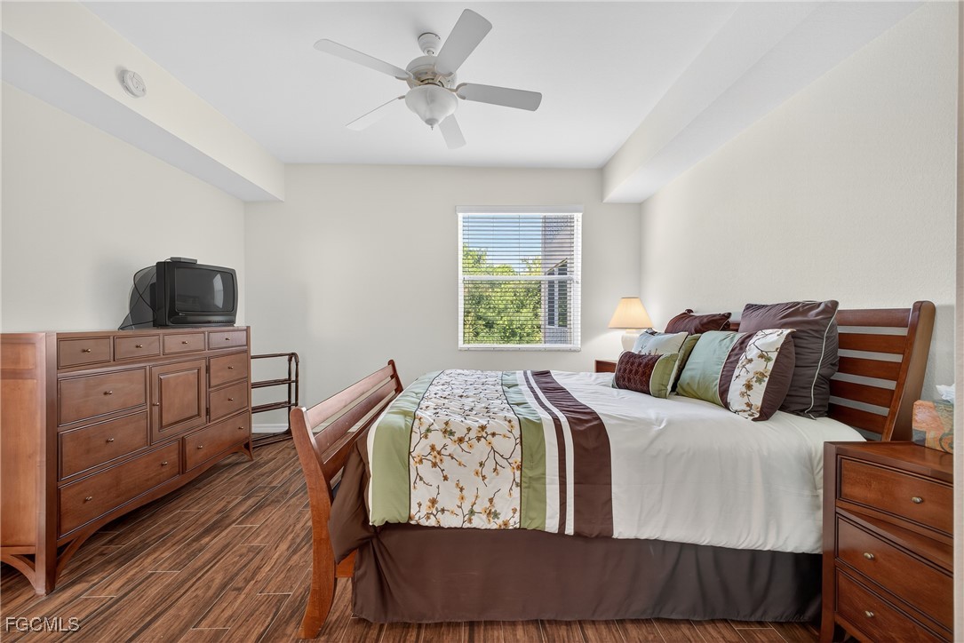 8251 Pathfinder Loop, Unit 621 Fort Myers, FL 33919 - Photo 17 of 32 a bed room with a bed and a window