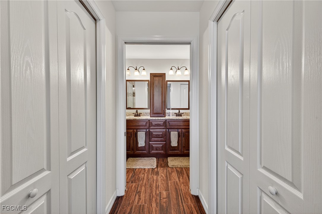 8251 Pathfinder Loop, Unit 621 Fort Myers, FL 33919 - Photo 20 of 32 a view of a bathroom from the hallway