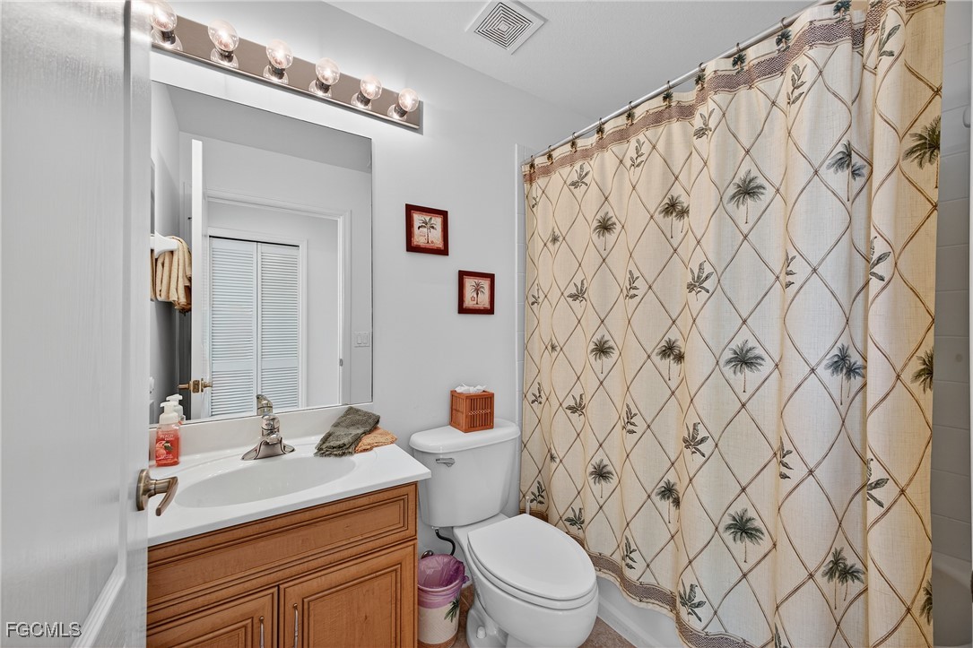 8251 Pathfinder Loop, Unit 621 Fort Myers, FL 33919 - Photo 24 of 32 a bathroom with a sink toilet and shower