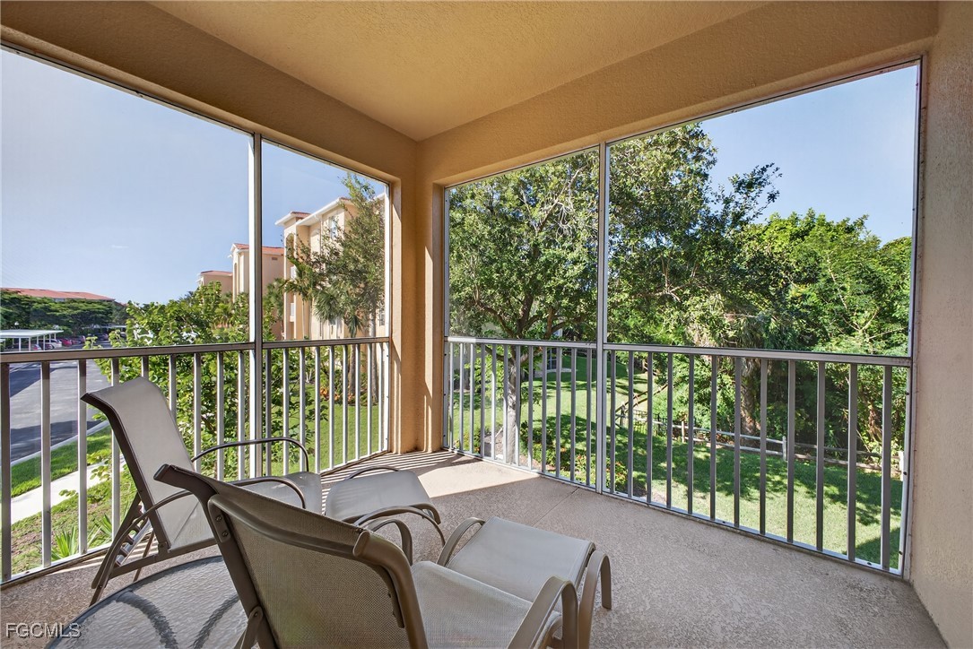 8251 Pathfinder Loop, Unit 621 Fort Myers, FL 33919 - Photo 3 of 32 a balcony with furniture