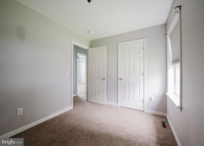 207 Broad Street Hurlock, MD 21643 - Photo 11 of 19 a view of an empty room with a window