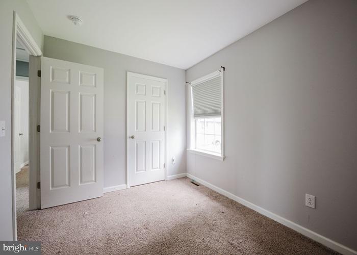 207 Broad Street Hurlock, MD 21643 - Photo 12 of 19 a view of an empty room with a window