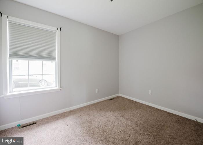 207 Broad Street Hurlock, MD 21643 - Photo 13 of 19 an empty room with a window