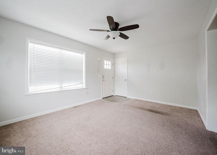 207 Broad Street Hurlock, MD 21643 - Photo 5 of 19 an empty room with a window
