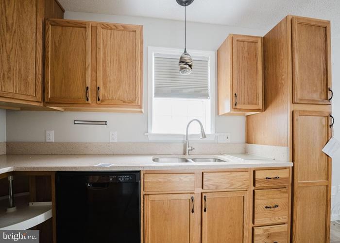 207 Broad Street Hurlock, MD 21643 - Photo 7 of 19 a kitchen with stainless steel appliances granite countertop a sink a refrigerator and a cabinets with wooden floor