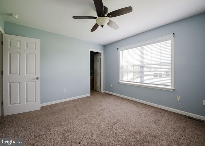 207 Broad Street Hurlock, MD 21643 - Photo 9 of 19 a view of an empty room with a window