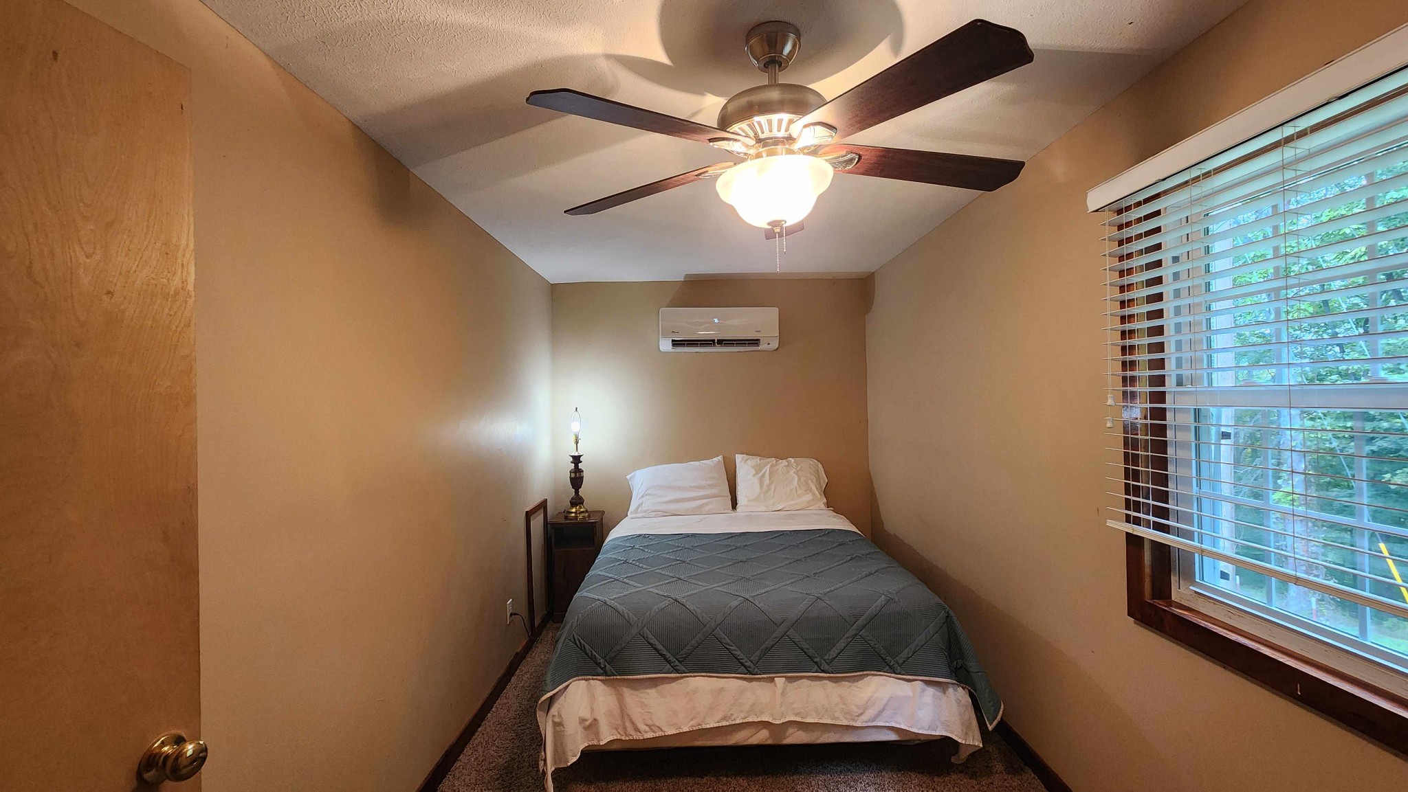 348 Bill Hunter Road Celina, TN 38551 - Photo 12 of 50 a bedroom with a bed and window