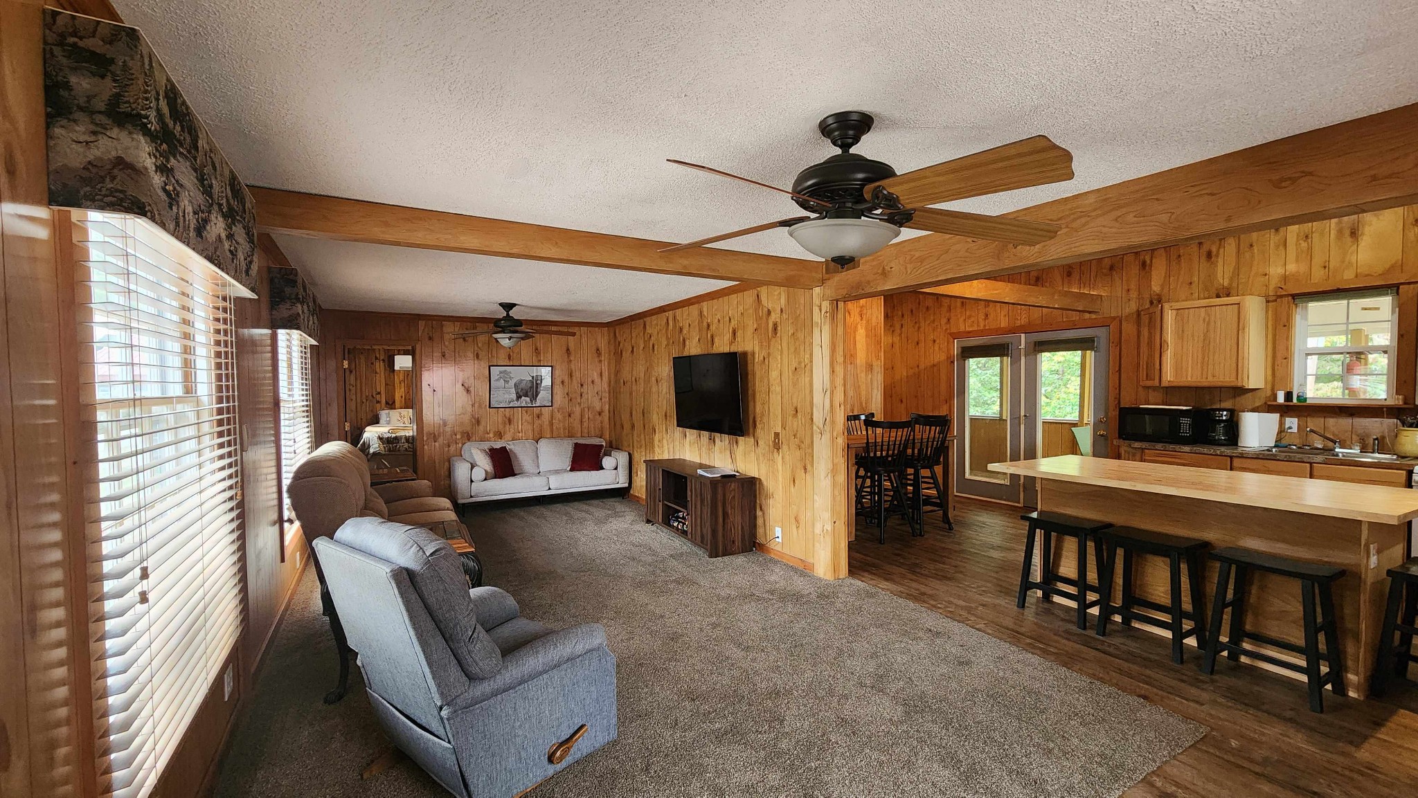 348 Bill Hunter Road Celina, TN 38551 - Photo 23 of 50 a living room with furniture and a flat screen tv