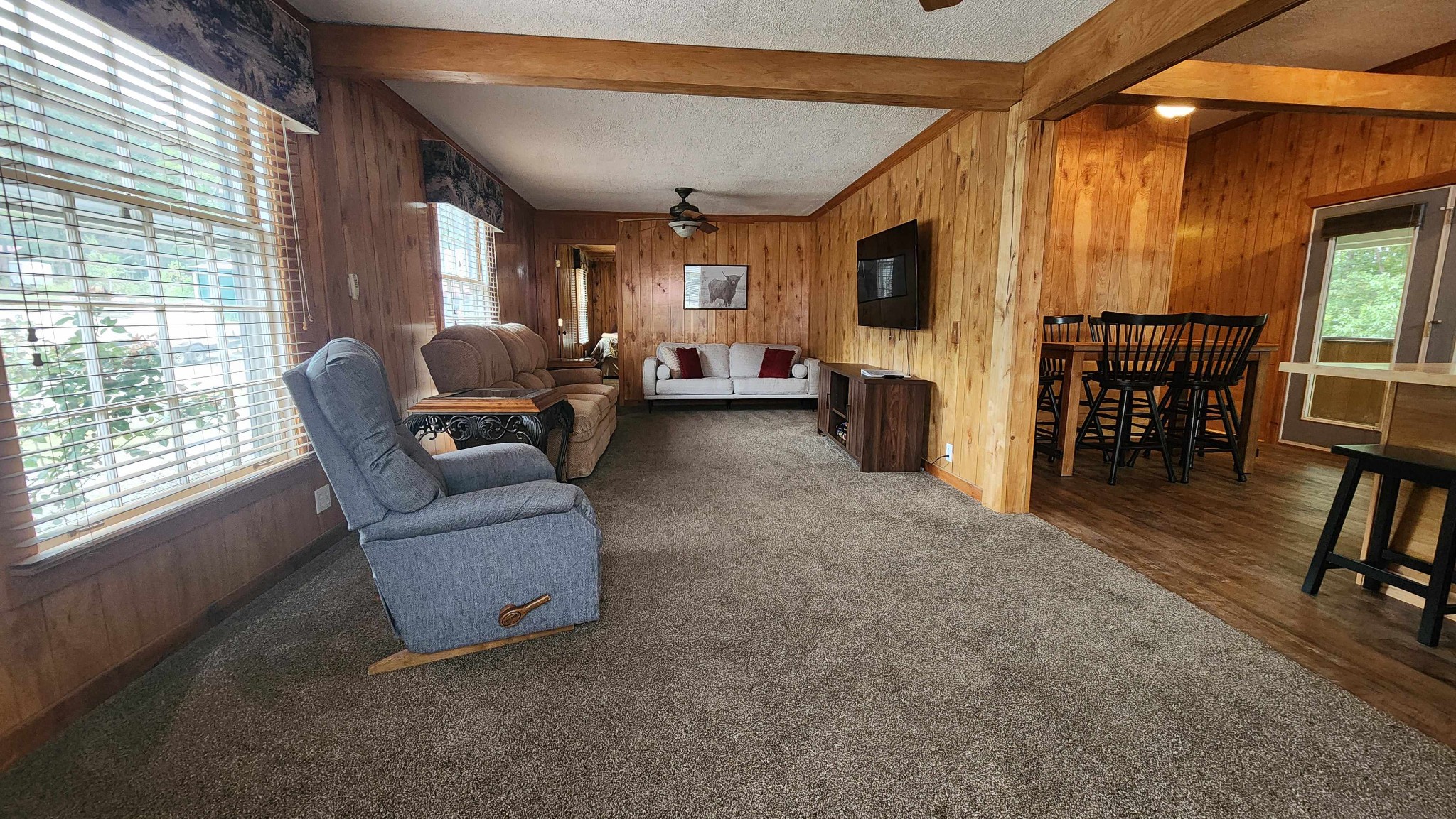 348 Bill Hunter Road Celina, TN 38551 - Photo 25 of 50 a living room with furniture and a flat screen tv