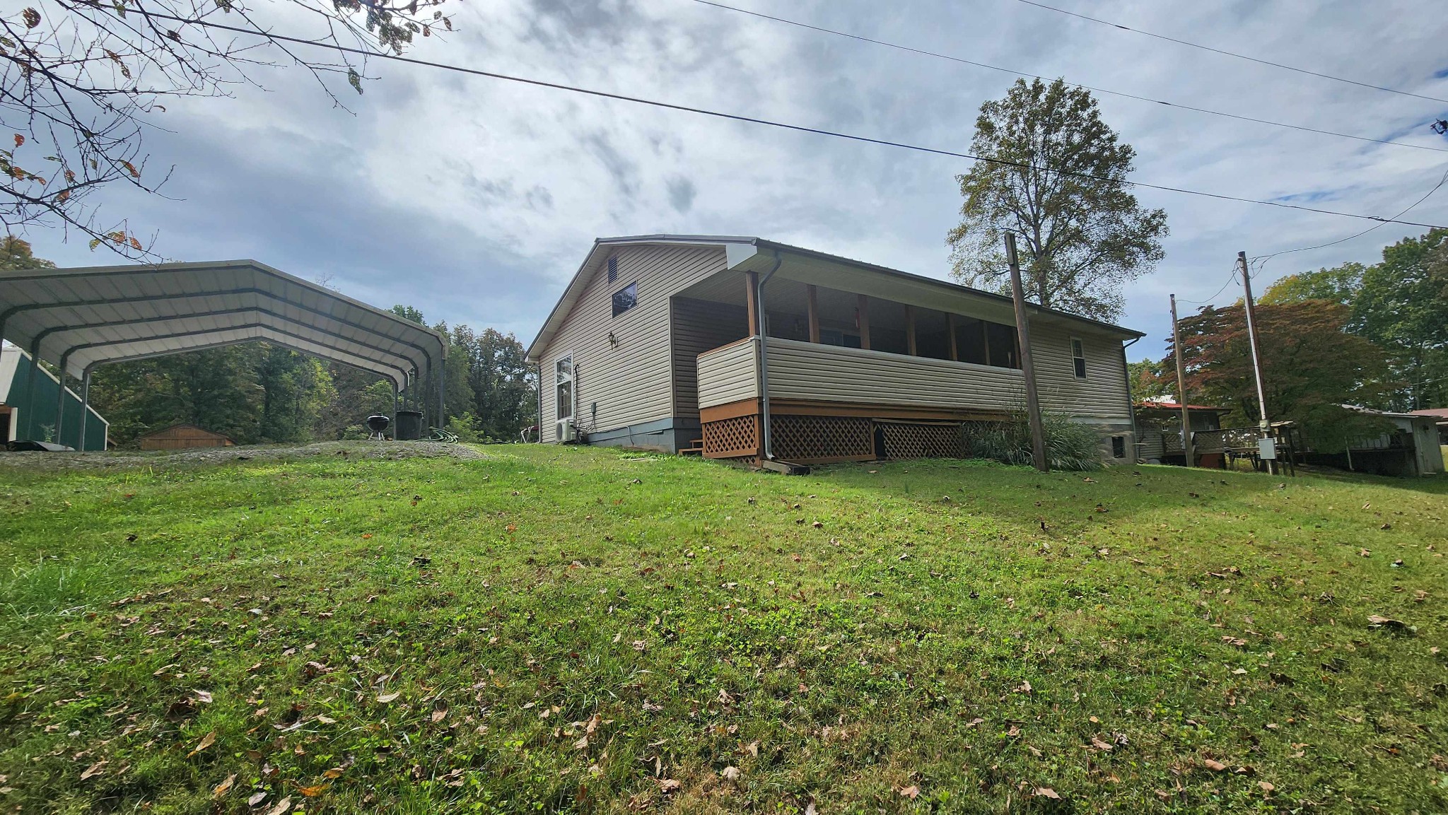 348 Bill Hunter Road Celina, TN 38551 - Photo 30 of 50 a view of a house with a yard
