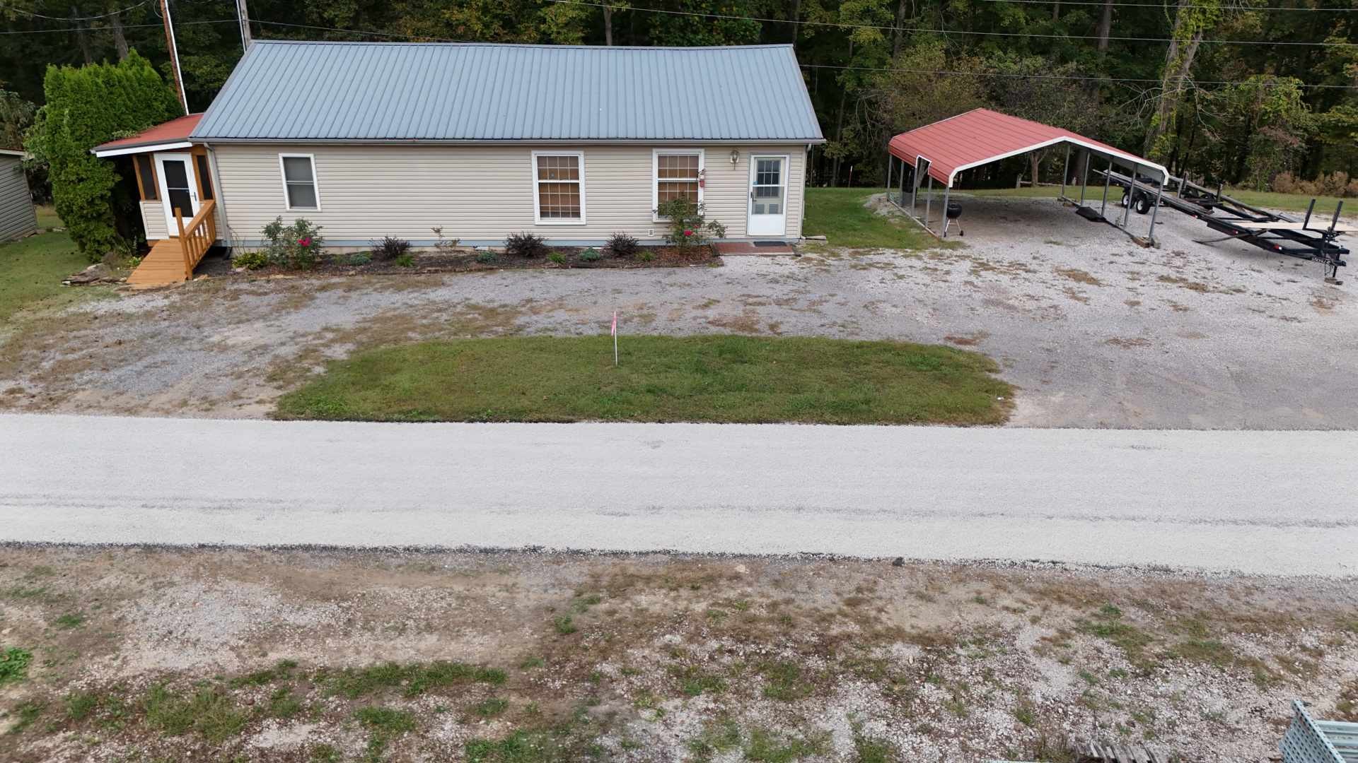 348 Bill Hunter Road Celina, TN 38551 - Photo 37 of 50 a front view of a house with a garden