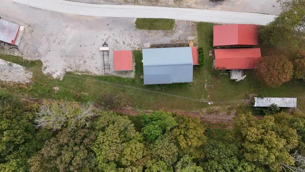 an aerial view of a house with a garden